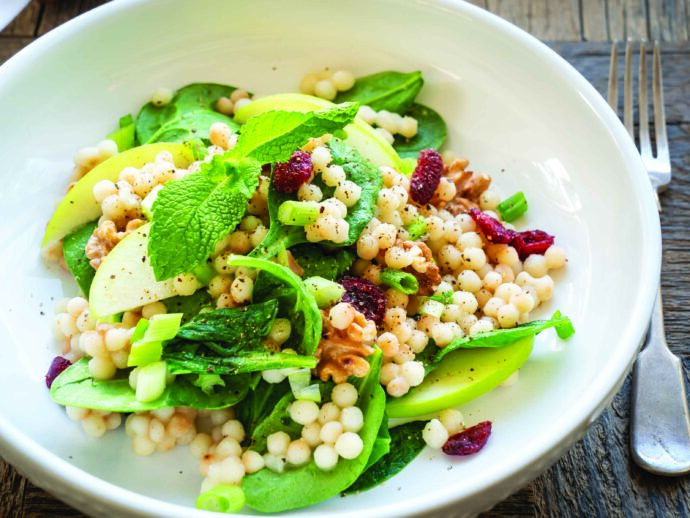 Warm Pearl Couscous Bowl with Spinach, Apple, Walnuts, and Tahini Dressing