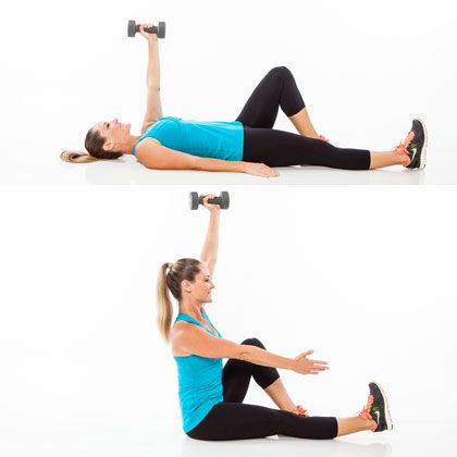 ab workout with weights female: woman demonstrating how to do a single-arm sit-up abs exercise with weights