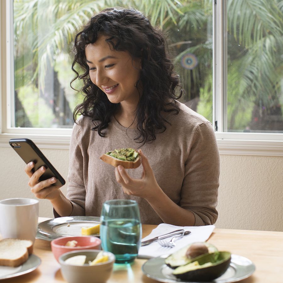 Woman eating avocado toast