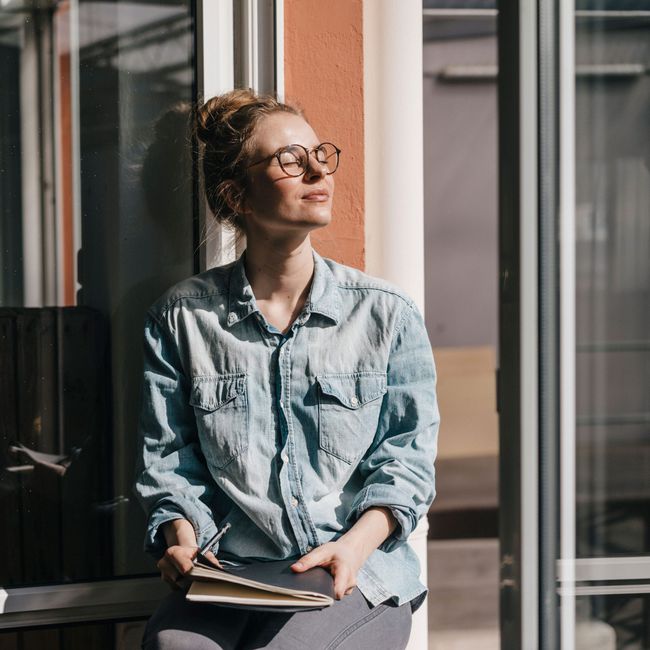 Woman_Enjoying_Sun_on_Her_Face