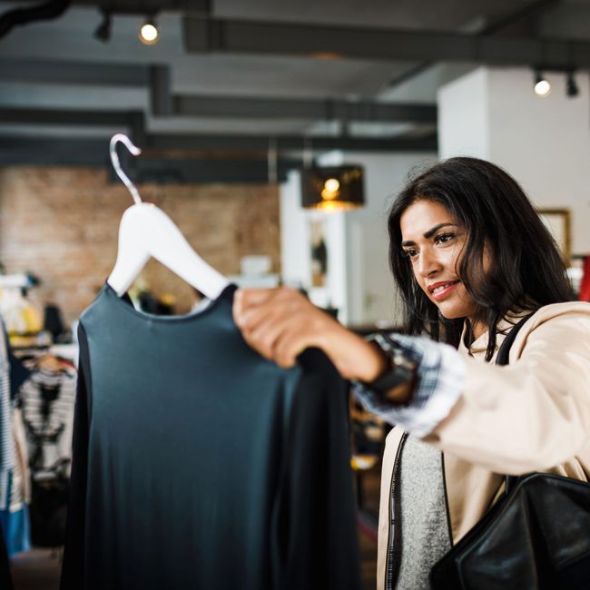 Woman_Struggling_to_Decide_Over_Sweater