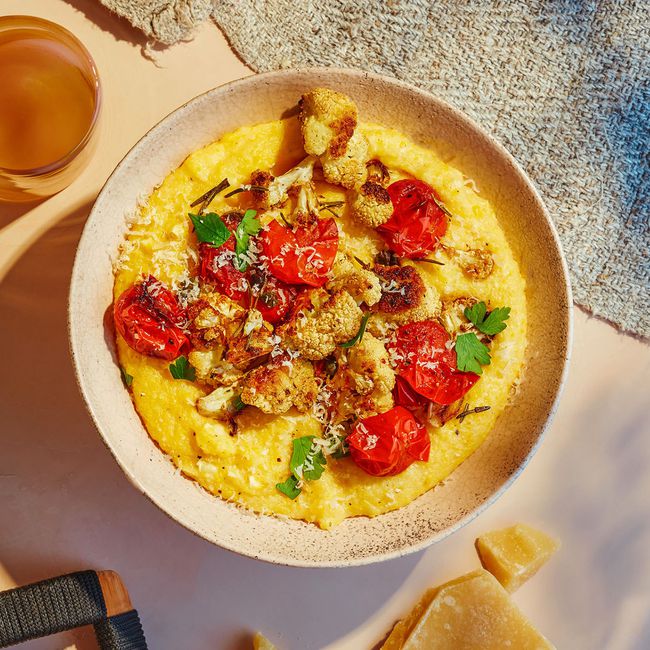 Cauliflower & Tomato Ragù Over Polenta With Crispy Rosemary